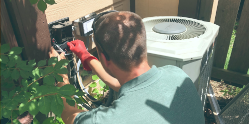 man installing AC